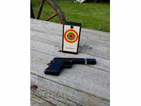 Old Toy Pistol and Target