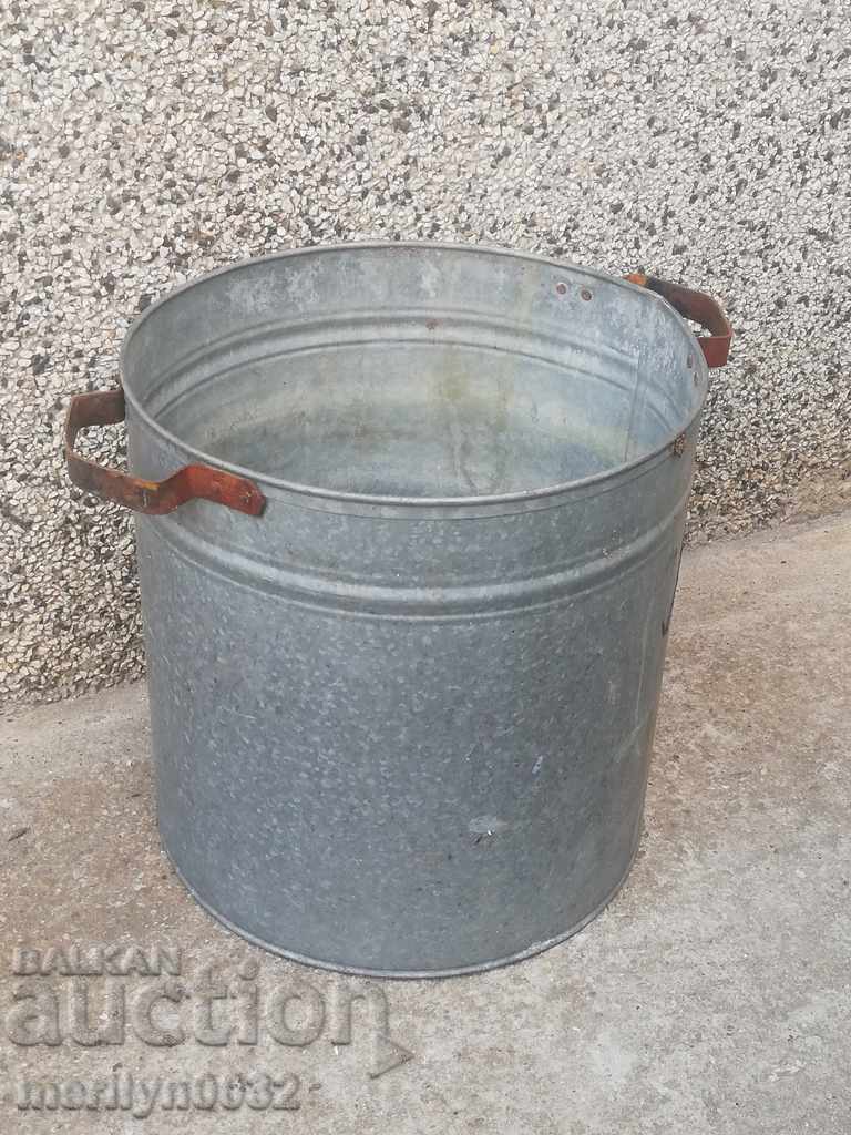 An old metal bucket bucket, a binon