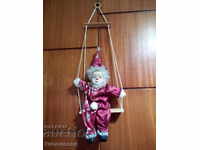 Doll with swing