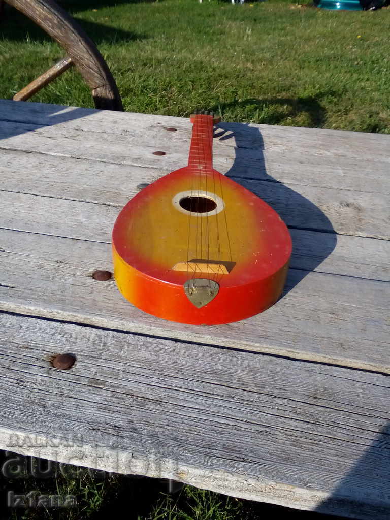 Old children's guitar with price 30.00 BGN | € 15.34 Old children's guitar with price 30.00 BGN | € 15.34