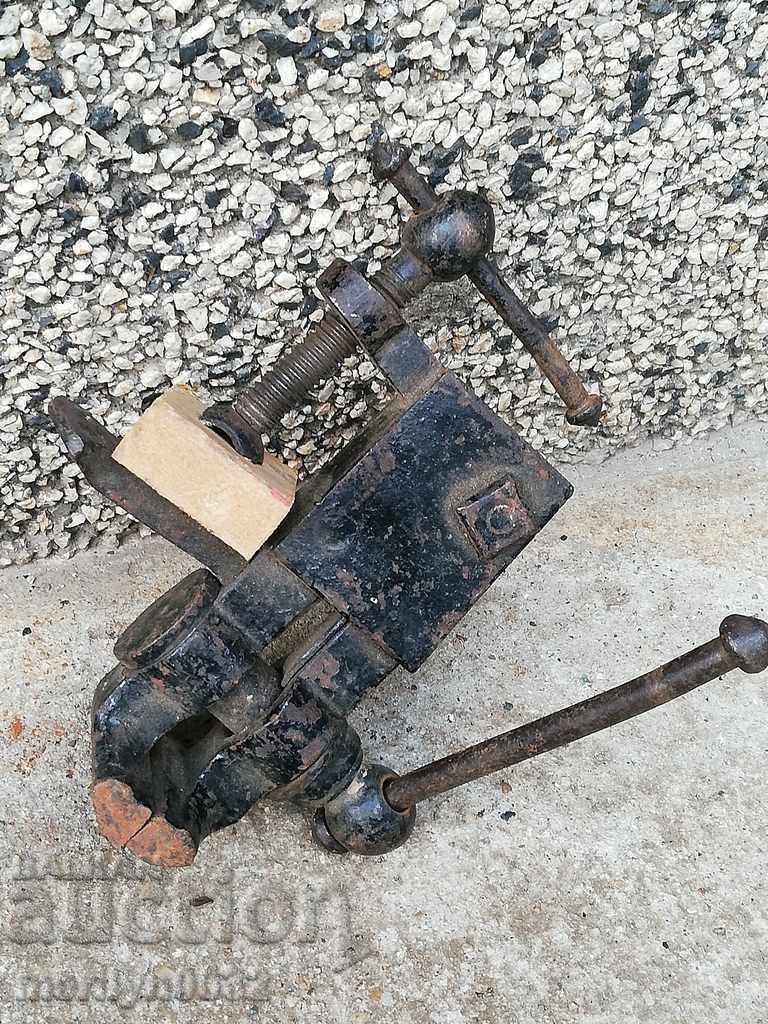 An old vise clamps a hardware tool with price 69.00 BGN | € 35.28