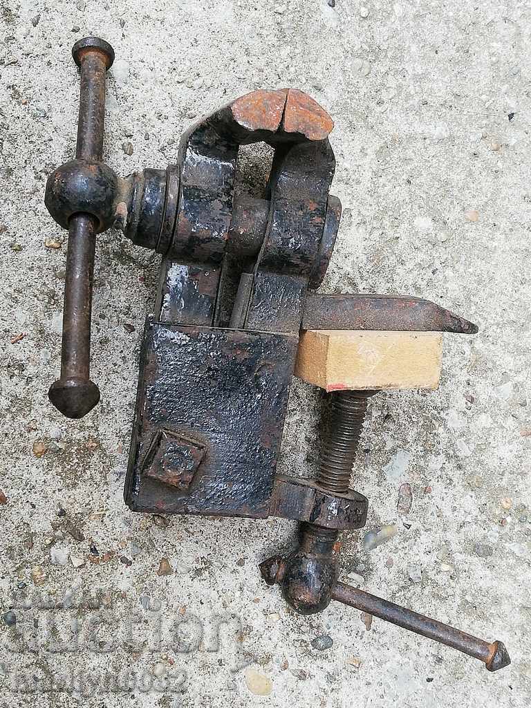 An old vise clamps a hardware tool - 5