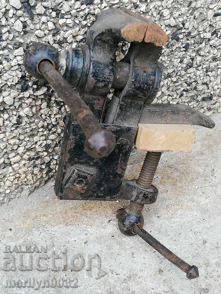 An old vise clamps a hardware tool - 6