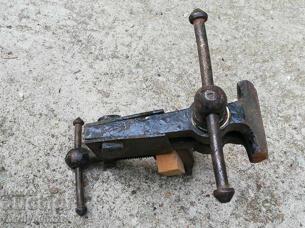 An old vise clamps a hardware tool - 7