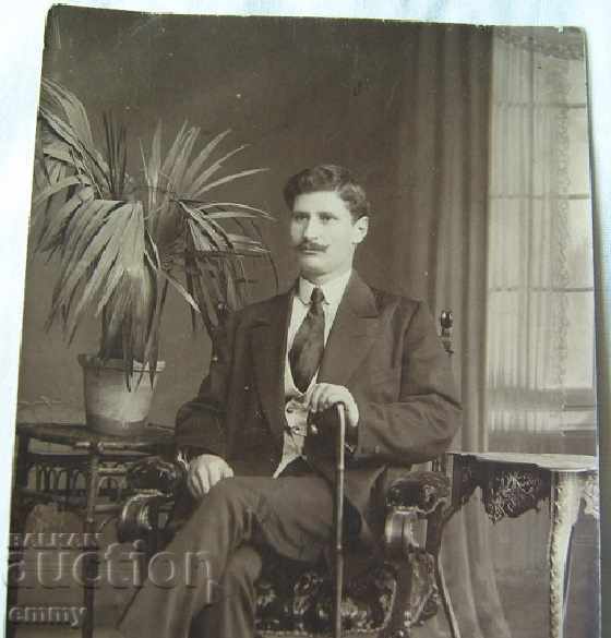 An old photo of a man with a cane is sitting with price 5.00 BGN | € 2.56 An old photo of a man with a cane is sitting with price 5.00 BGN | € 2.56