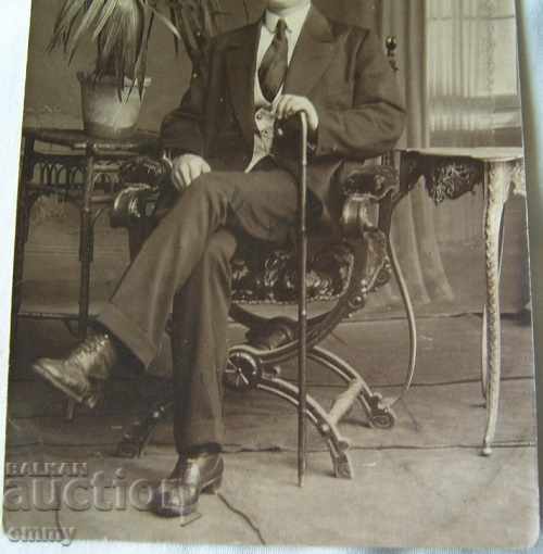 Auction An old photo of a man with a cane is sitting Auction An old photo of a man with a cane is sitting