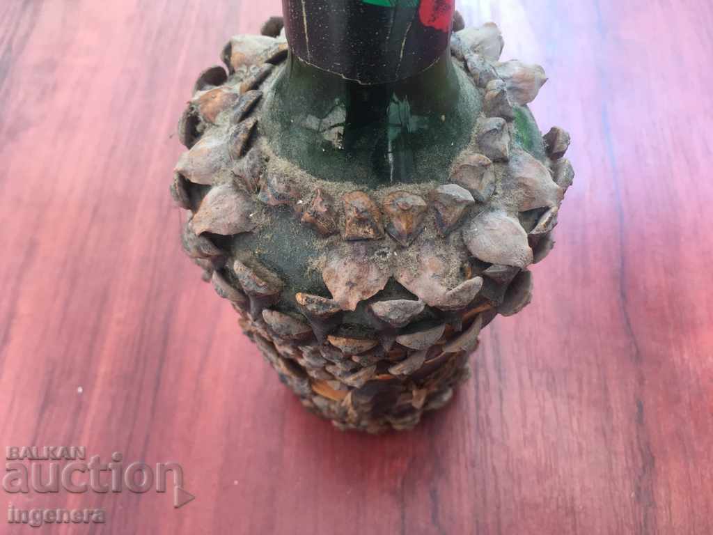 Delivery of Bottle More Decorated with Veneer and Old Cones