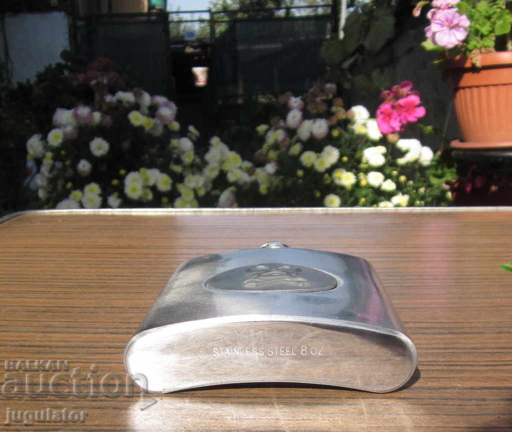 Delivery of new metal pocket for alcohol with skull and bone Delivery of new metal pocket for alcohol with skull and bone