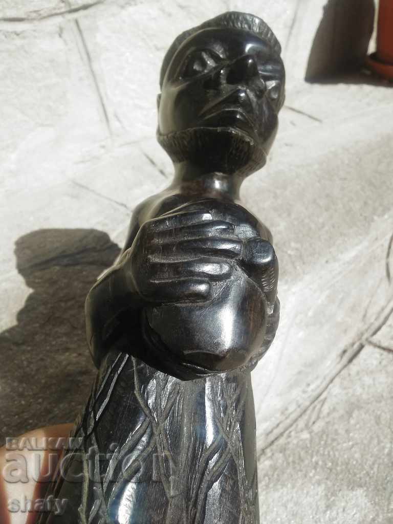 Livrarea O figură veche de abanos. Sculptura din lemn. Livrarea O figură veche de abanos. Sculptura din lemn.