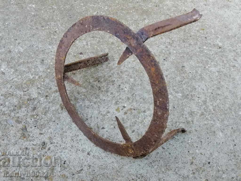 Auction  An old wrought iron soot, wrought iron, a primitive pyrosty