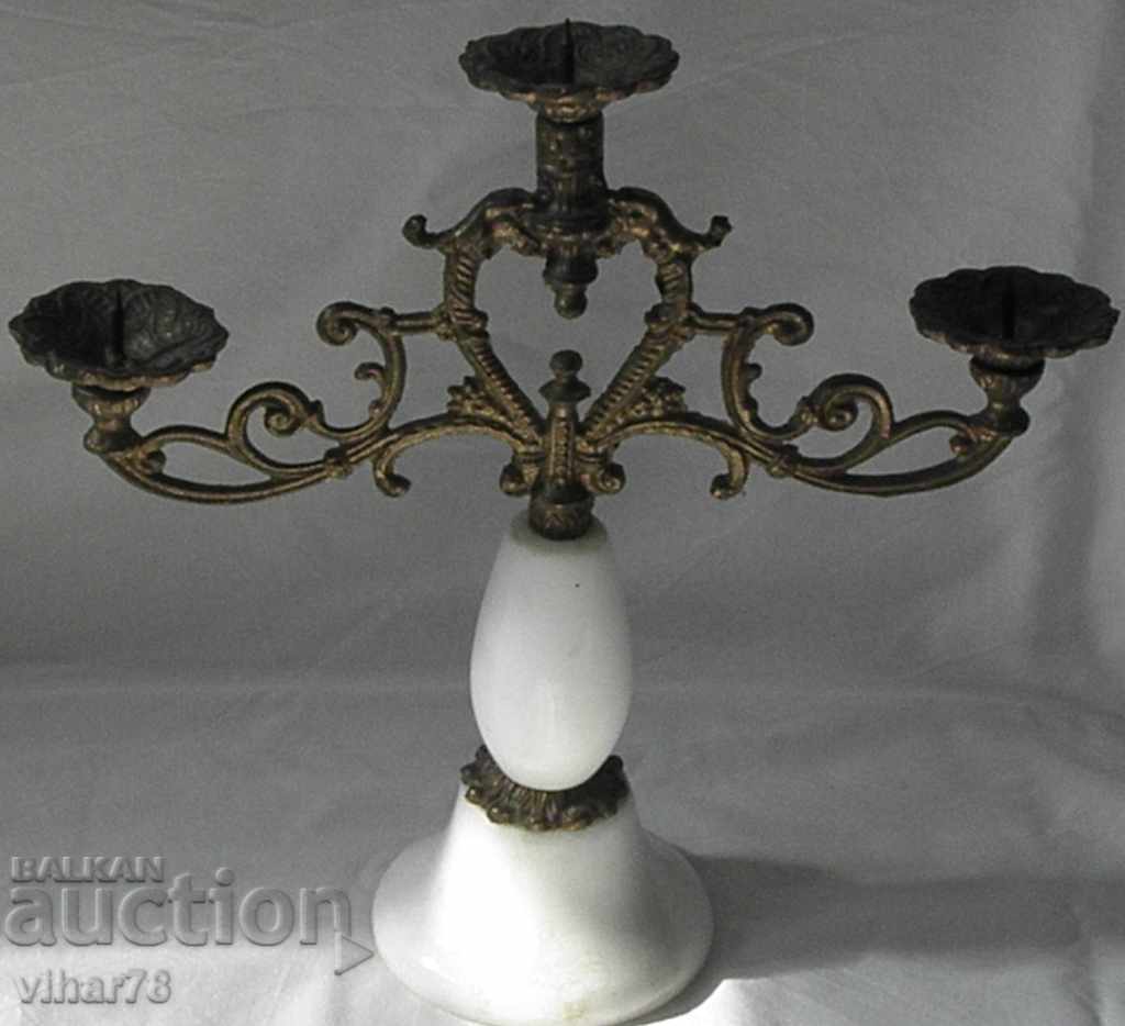 old metal candlestick with marble