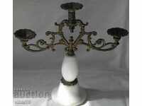 Old metal candlestick with marble