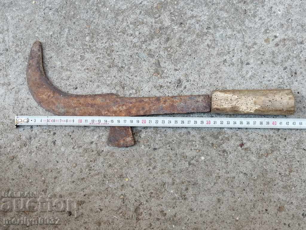 Delivery of An old tool, an instrument, a hand forged cutter, a chopper, a machete Delivery of An old tool, an instrument, a hand forged cutter, a chopper, a machete