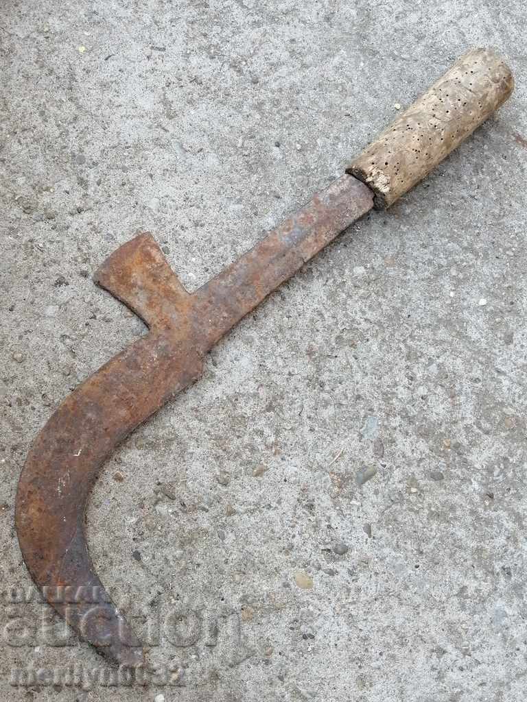 An old tool, an instrument, a hand forged cutter, a chopper, a machete