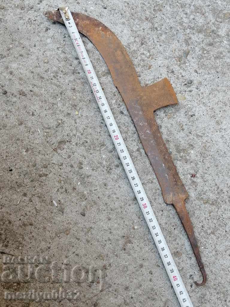 Delivery of An old tool, an instrument, a hand forged cutter, a chopper, a machete Delivery of An old tool, an instrument, a hand forged cutter, a chopper, a machete