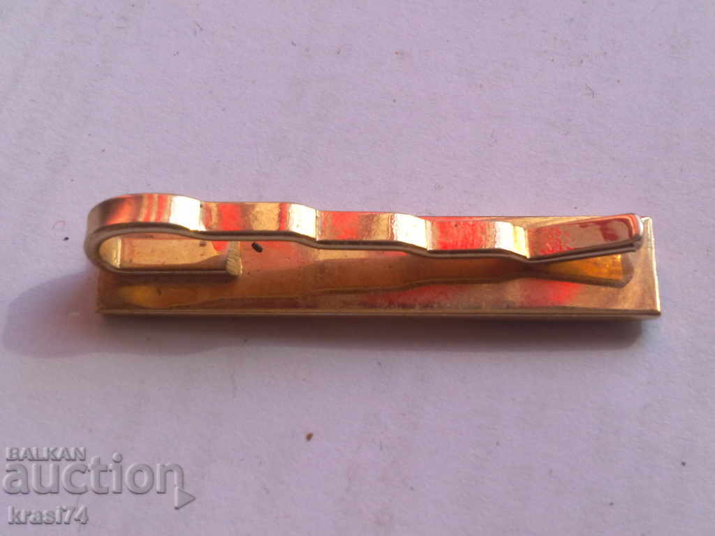 An old, gilded tie needle with price 10.00 BGN | € 5.11
