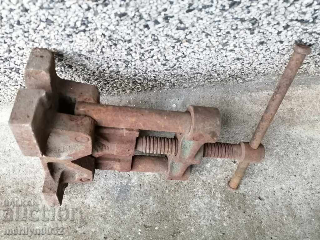 An old pipe clamp clamps an iron tool with price 69.00 BGN | € 35.28