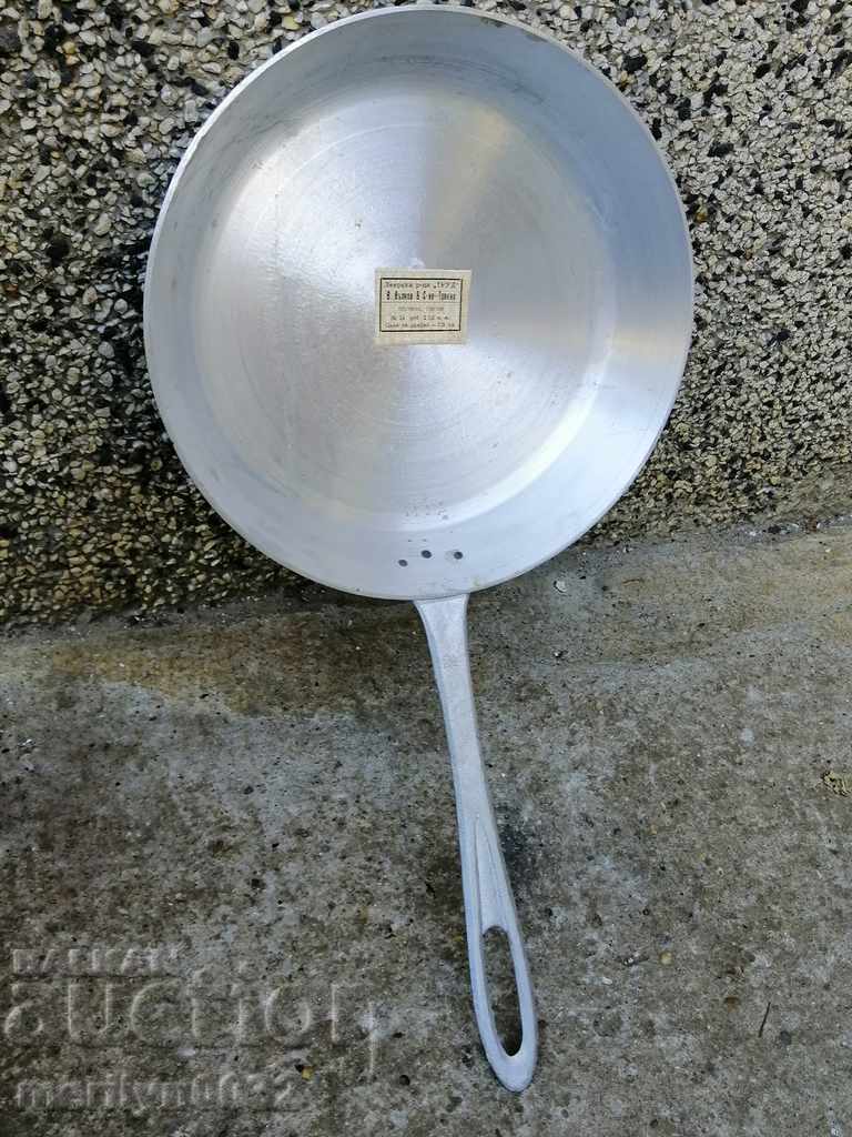 Old 1946 aluminum pan labeled kitchenware