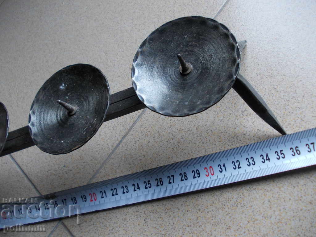 Auction  Massive forged candlestick