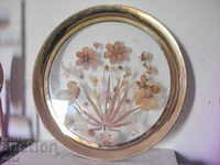 Old brass tray with dried flowers