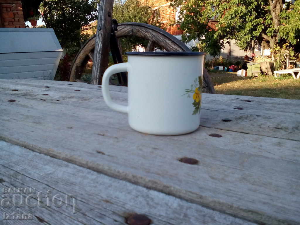 Auction  Old enameled jug, cup