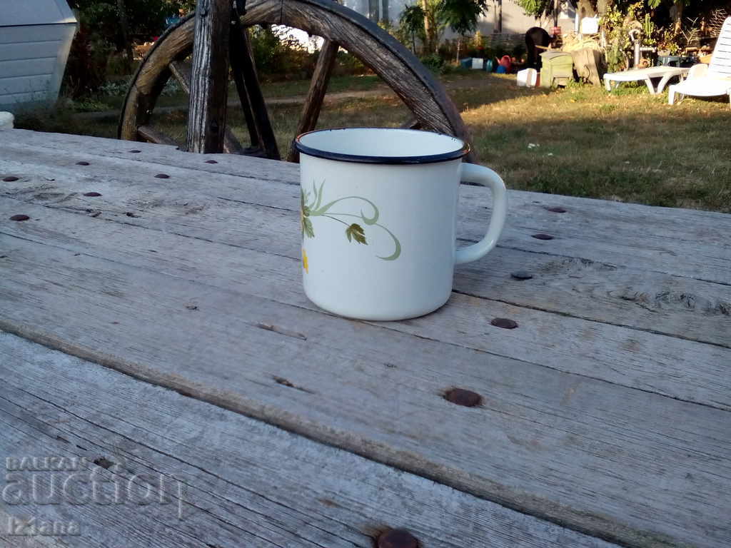 Old enameled jug, cup