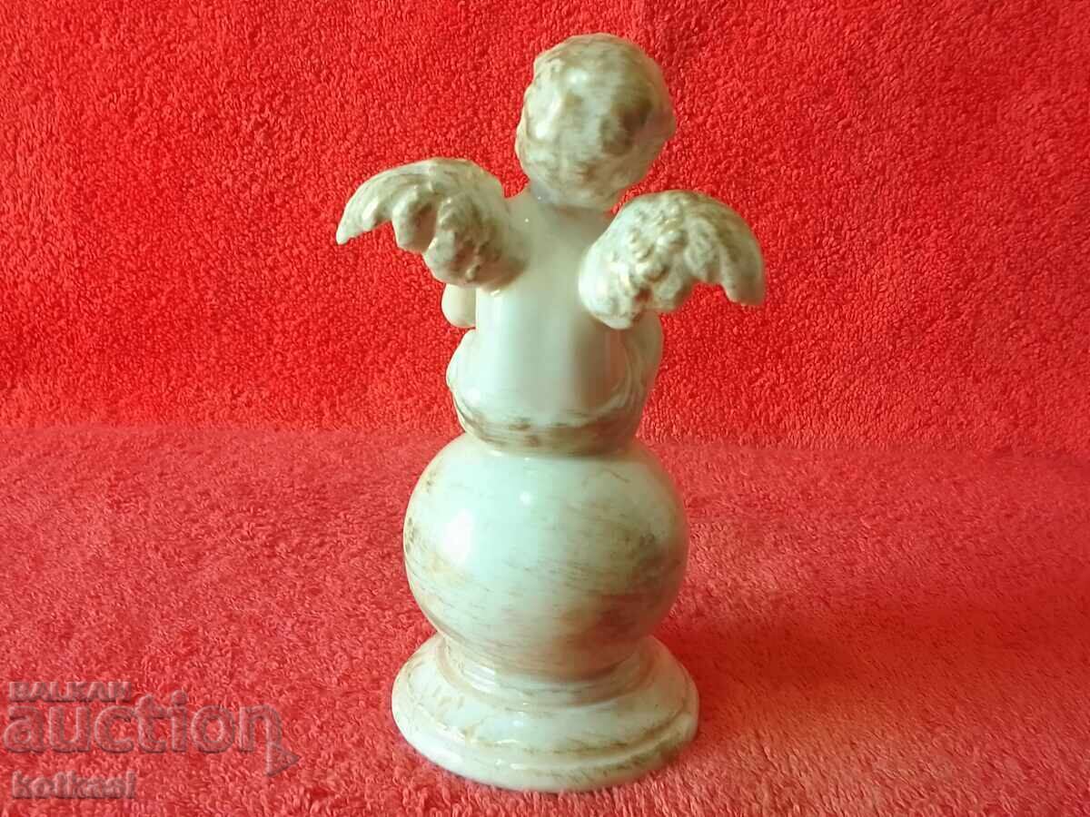 Delivery of Old Porcelain Figure of an Angel Sitting on a Ball