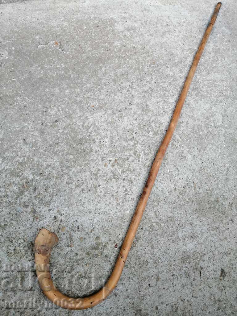 Auction  An old cane made of wood. of the 20th century