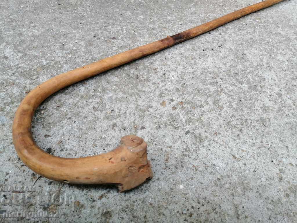 Delivery of An old cane made of wood. of the 20th century