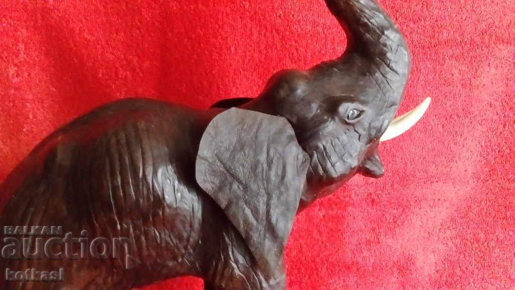 Old figure of an Elephant, height 35 cm. Wood, Leather with price 95.50 BGN | € 48.83 Old figure of an Elephant, height 35 cm. Wood, Leather with price 95.50 BGN | € 48.83