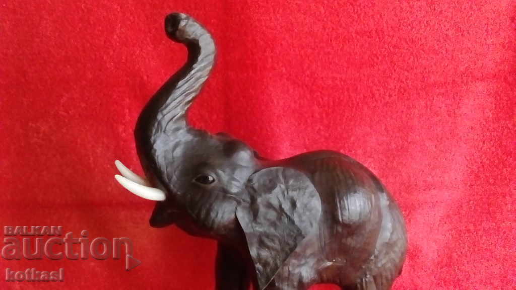 Auction Old figure of an Elephant, height 35 cm. Wood, Leather Auction Old figure of an Elephant, height 35 cm. Wood, Leather