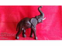 Old figure of an Elephant, height 35 cm. Wood, Leather