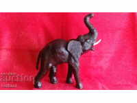 Old figure of an Elephant, height 35 cm. Wood, Leather