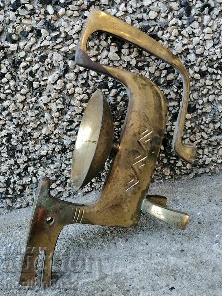 Delivery of Old brass candlestick with figure