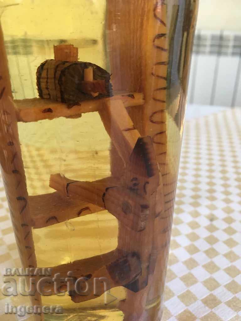 Auction  RAKIYA BOTTLE WITH WOOD COMPOSITION