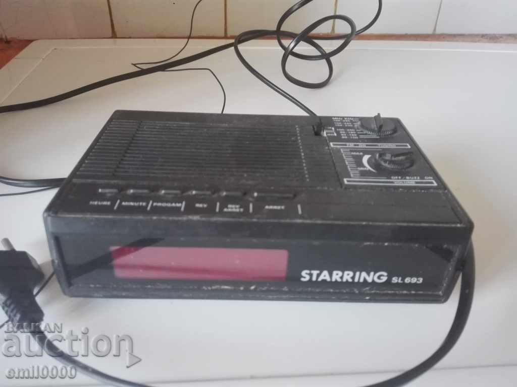 Old radio alarm clock with price 11.99 €