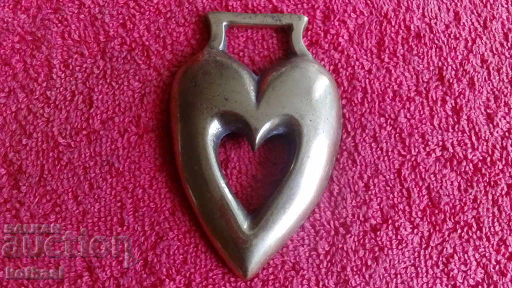 Old solid bronze paneled figure Heart
