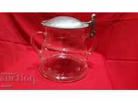 Large glass container with metal lid
