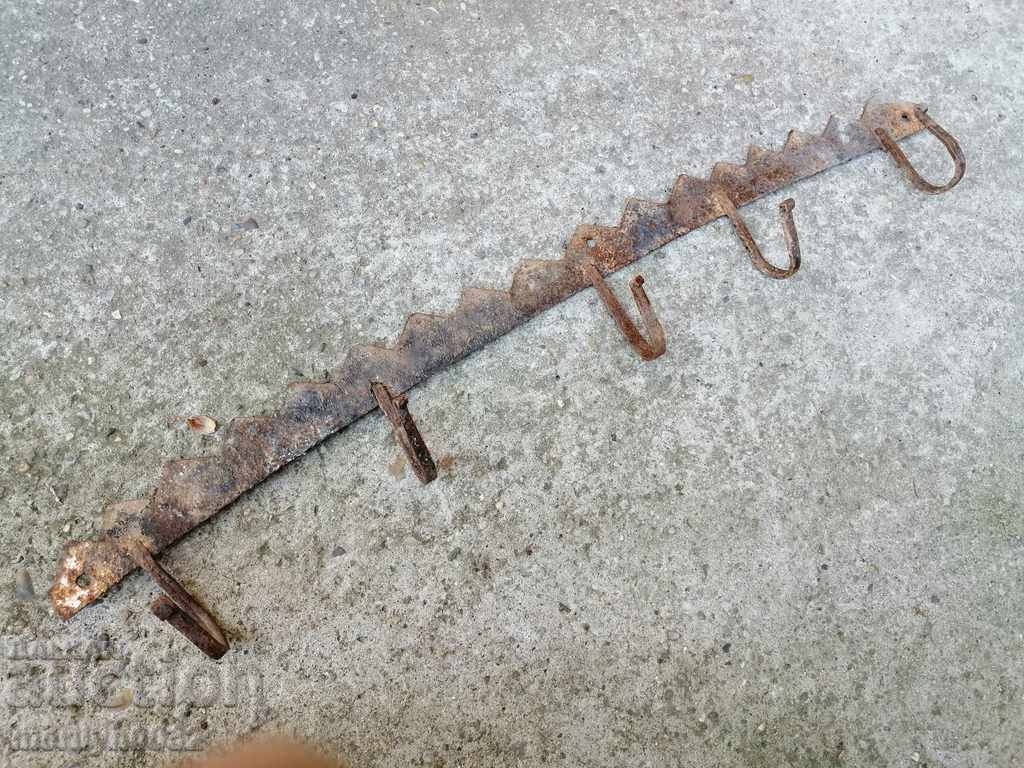 Old metal forged hanger wrought iron primitive