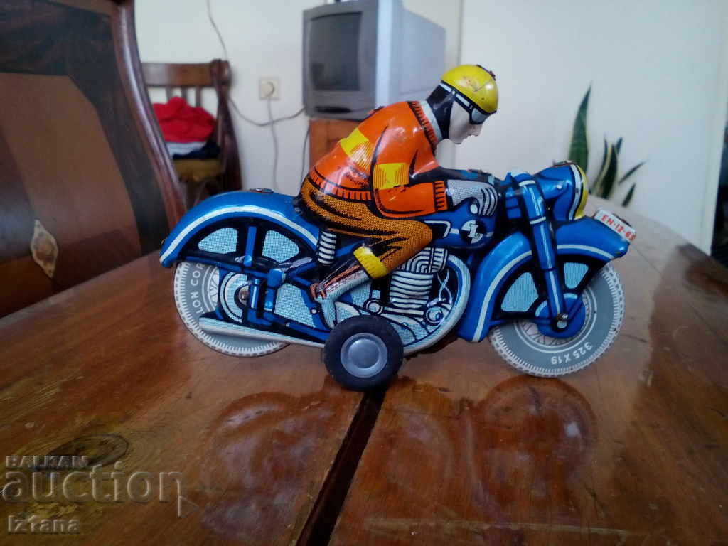 Auction Old toy motorcycle Auction Old toy motorcycle