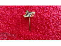 Old metal bronze sports badge needle
