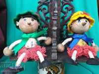 Two old dolls with stand