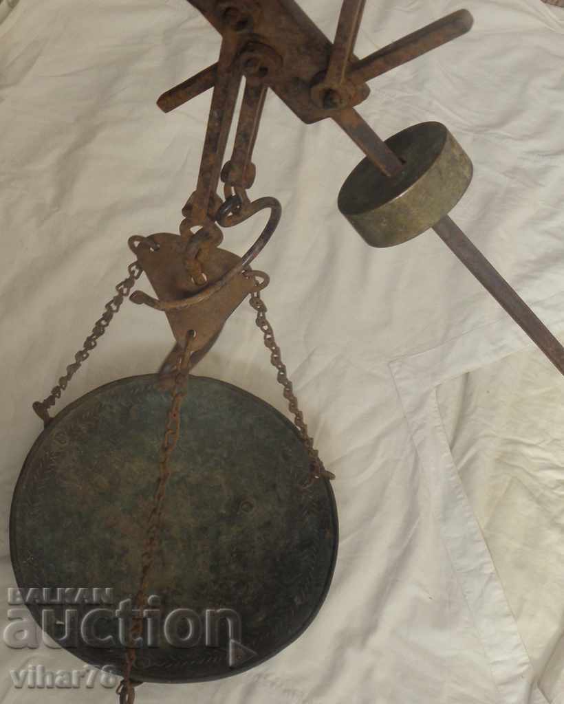 AN OLD SCALE WITH MANY MARKINGS AND STAMPS