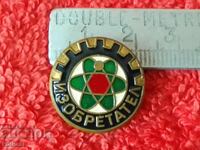 Old solid metal bronze INVENTOR badge