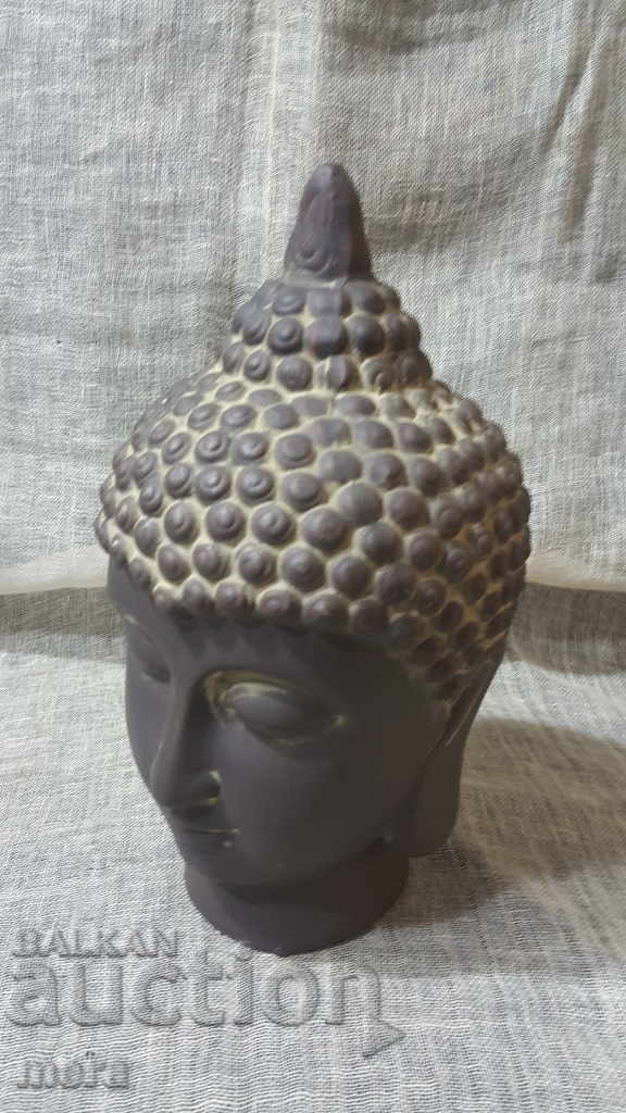 A spectacular ceramic replica of a Buddhist deity