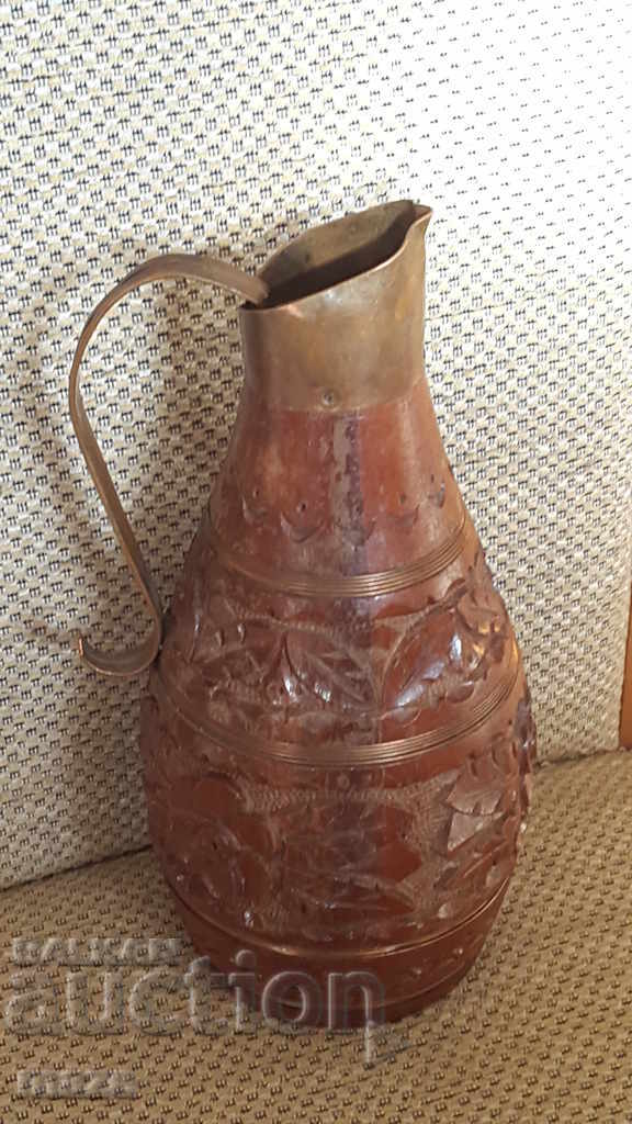 Wooden hand-carved pitcher