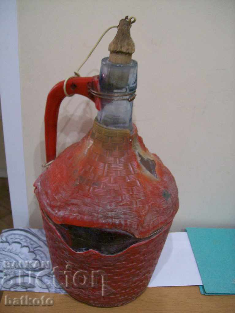An old 3 liter damajana bottle with a damaged honeycomb braid with price 4.00 BGN | € 2.05 An old 3 liter damajana bottle with a damaged honeycomb braid with price 4.00 BGN | € 2.05