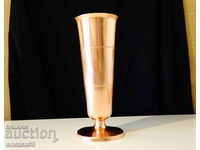 Copper cup, glass, vase, napkin.