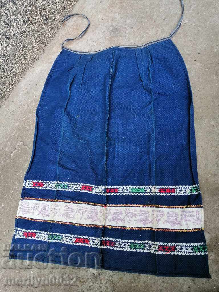 An old woven apron wearing a Sukman costume