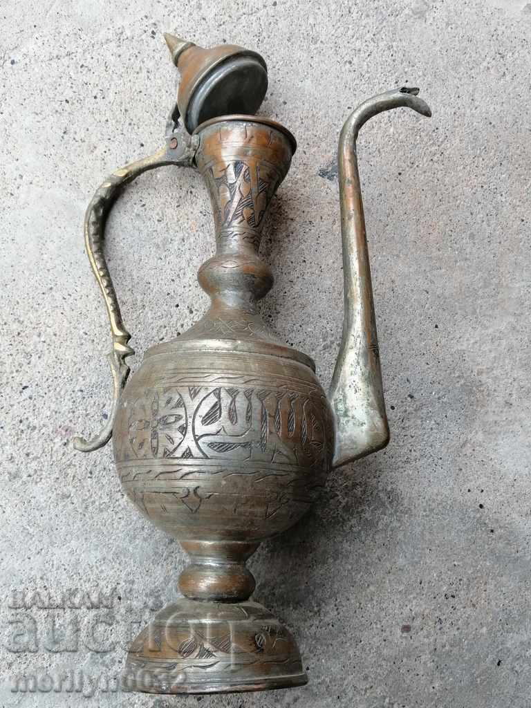 Old copper ewer, copper, jug, vessel with engravings Old copper ewer, copper, jug, vessel with engravings